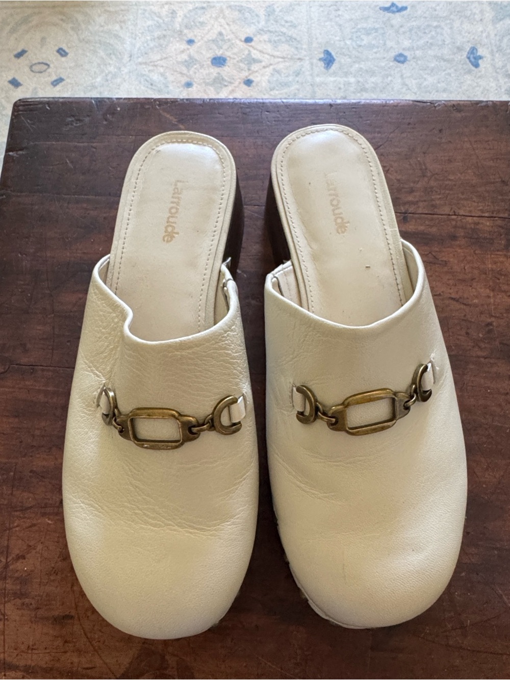 Larroude Cream Slip-On Mules with Brass Chain Accent